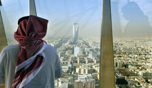 A man looks at central Riyadh from the Faisaliah Tower - Saudi Arabia, December 14, 2003...